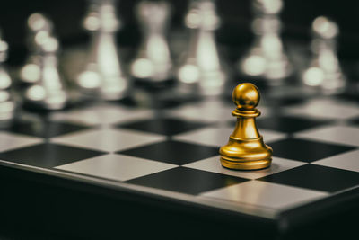 Close-up of chess pieces on table