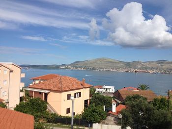 View of town against cloudy sky