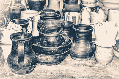 Clay dishes. brown pottery standing on the dusty old desktop