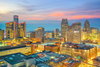 High angle view of illuminated buildings against sky during sunset