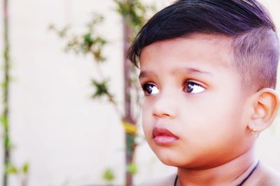 Portrait of cute boy looking away