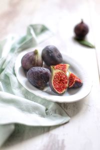 High angle view of fruits in plate on table
