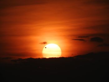 Silhouette landscape against sky during sunset