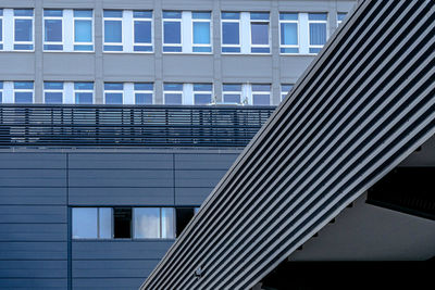 Low angle view of modern building with roof overhang in foreground