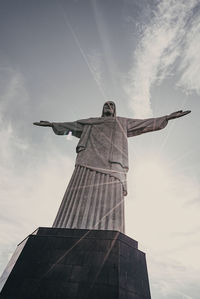 Low angle view of statue against cloudy sky