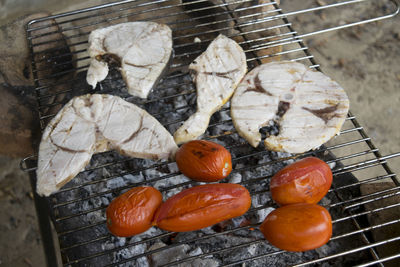 High angle view of meat on barbecue grill