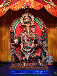 Statue of temple in building