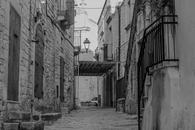 Alley amidst buildings in city