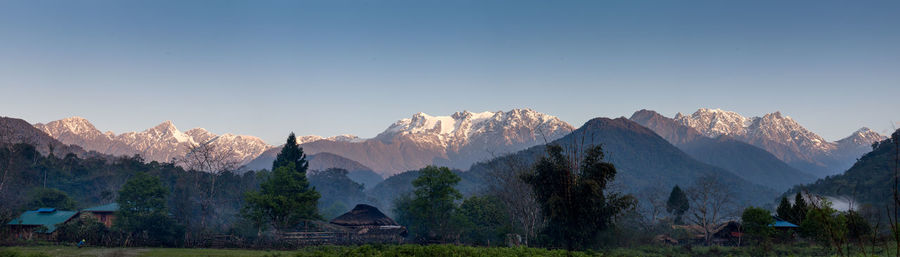 Panoramic view of mountain range against clear sky