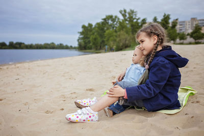 Woman sitting on beach