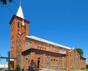 Low angle view of building against blue sky