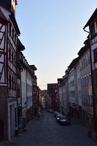 Street in city against clear sky