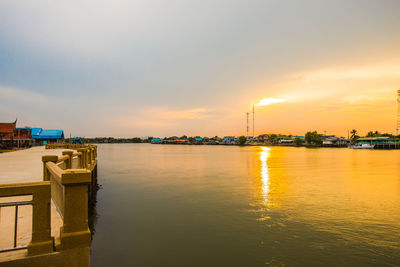 Scenic view of lake against sky during sunset