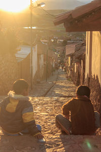 Rear view of people sitting in building