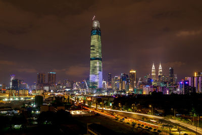 Illuminated modern buildings in city at night