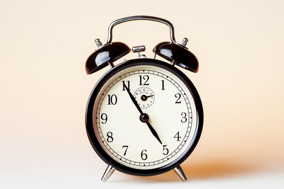 Close-up of clock against white background