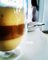 Close-up of coffee cup on table