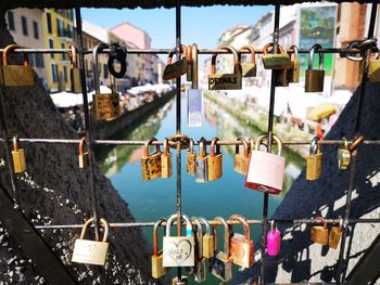 Padlocks hanging on railing