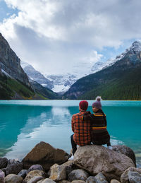Rear view of woman looking at lake