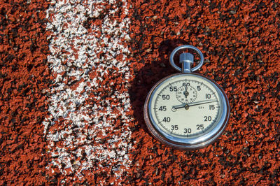 Close-up of stopwatch on field