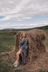 Full length of woman wearing hat on field against sky