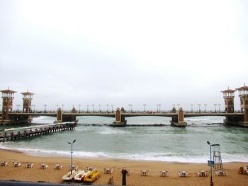 View of beach with city in background