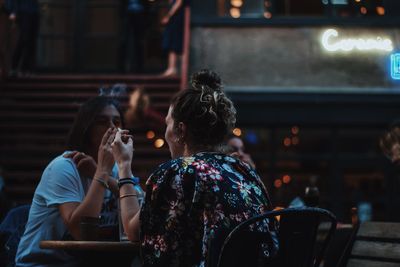 Rear view of people sitting in restaurant