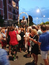 People on street in city at night