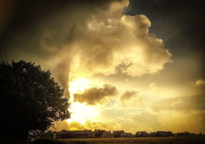 Scenic view of landscape against cloudy sky