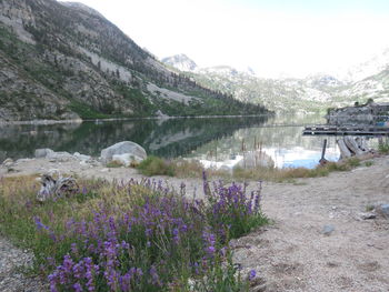 Scenic view of lake and mountains against sky