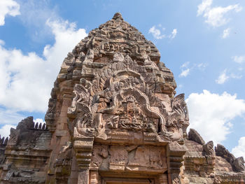 Low angle view of statue of temple against sky