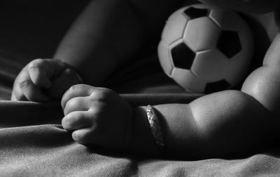 Close-up of baby with soccer ball