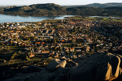 High angle view of townscape by sea