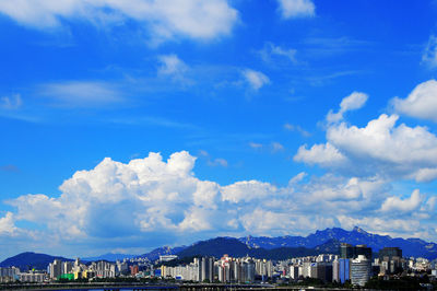 View of city against cloudy sky