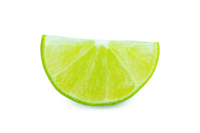 Close-up of lemon slice against white background