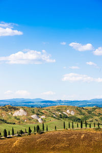 Scenic view of farm against sky