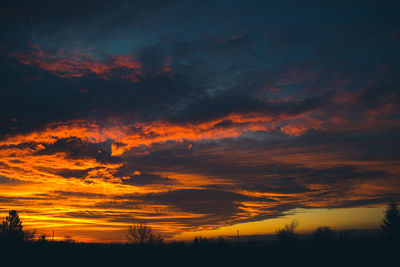 Low angle view of dramatic sky during sunset