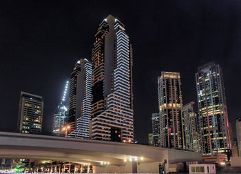 Illuminated buildings in city at night