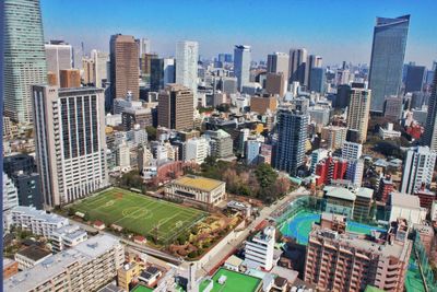 High angle view of buildings in city against sky