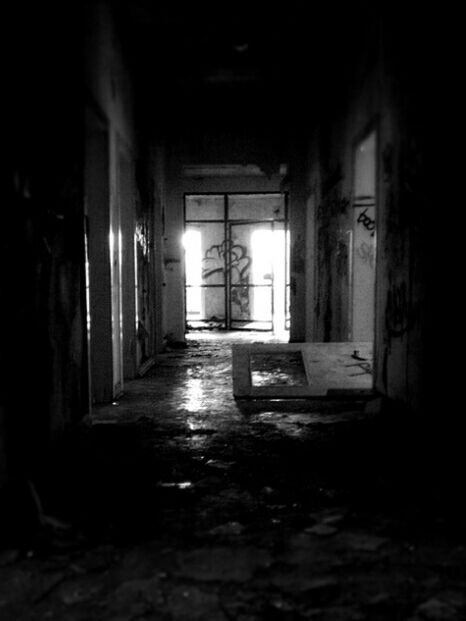 indoors, architecture, the way forward, built structure, corridor, empty, illuminated, interior, abandoned, absence, narrow, diminishing perspective, old, building, window, dark, door, flooring, no people, sunlight