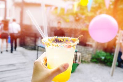 Cropped hand holding ice cream