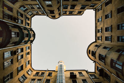 Low angle view of buildings against clear sky