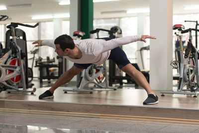 Muscular man exercising in gym