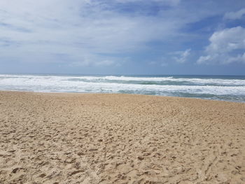 Scenic view of beach against sky