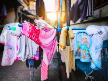Close-up of toys hanging at market stall