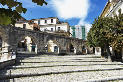 Part of the medieval aqueduct in sulmona garibaldi square , italy , beautiful stone staircase