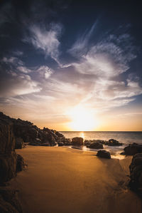 Scenic view of sea against sky at sunset