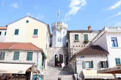 Street amidst buildings against sky