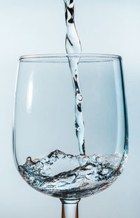 Close-up of wine glass against white background