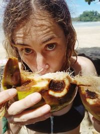 Close-up portrait of boy eating food